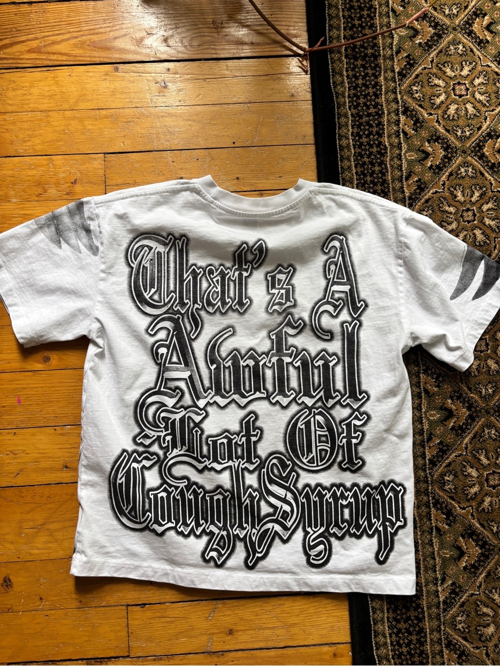 White Tee with Bold Gothic Print “That’s a awful lot of cough syrup”